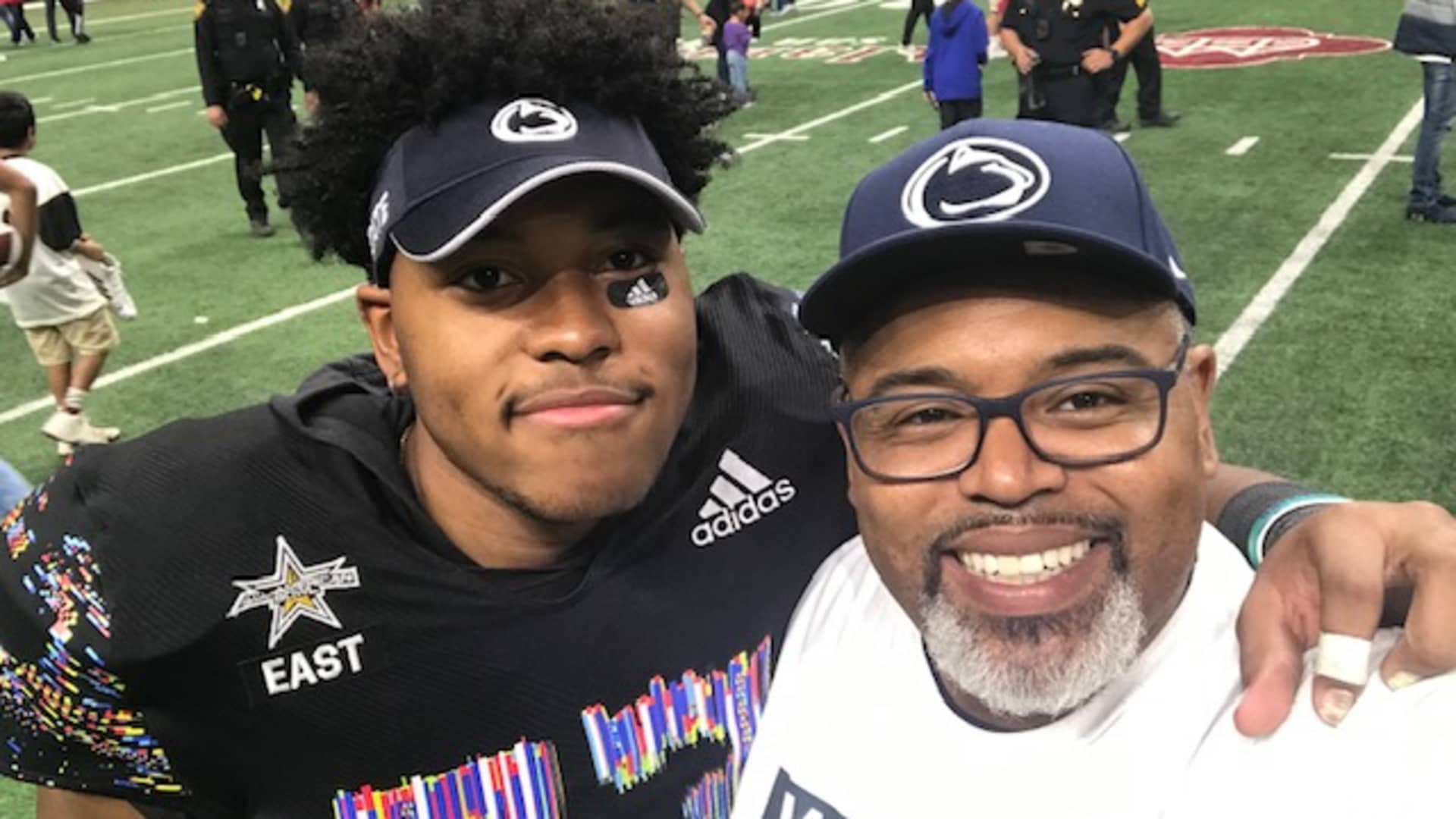 Penn State offensive lineman Caedan Wallace, pictured with his father, is currently juggling deals with a car dealership and athletic apparel store.