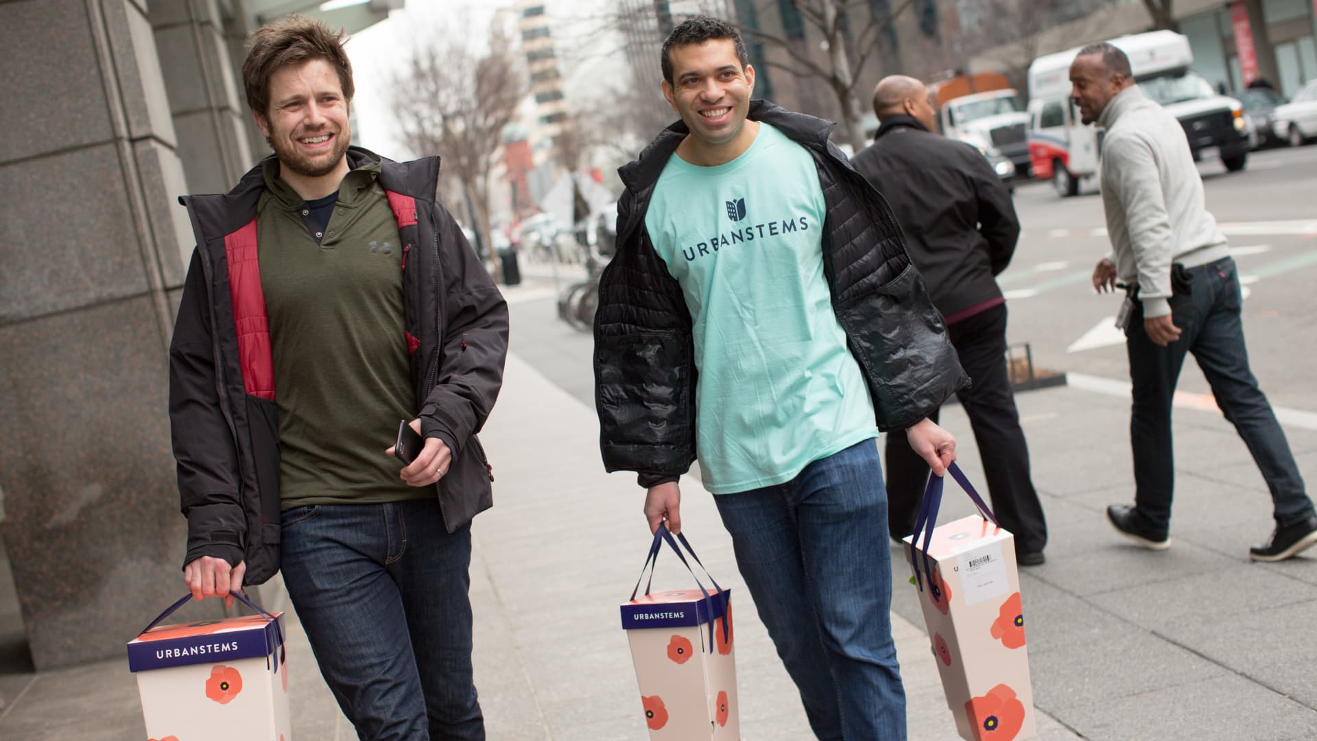 UrbanStems co-founders Jeff Sheely, left, and Ajay Kori, right, help deliver flowers on the company's busiest day of the year, Valentine's Day, in downtown Washington D.C., February 14, 2018.