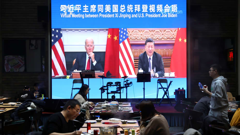 A screen shows Chinese President Xi Jinping attending a virtual meeting with U.S. President Joe Biden via video link, at a restaurant in Beijing, China November 16, 2021.