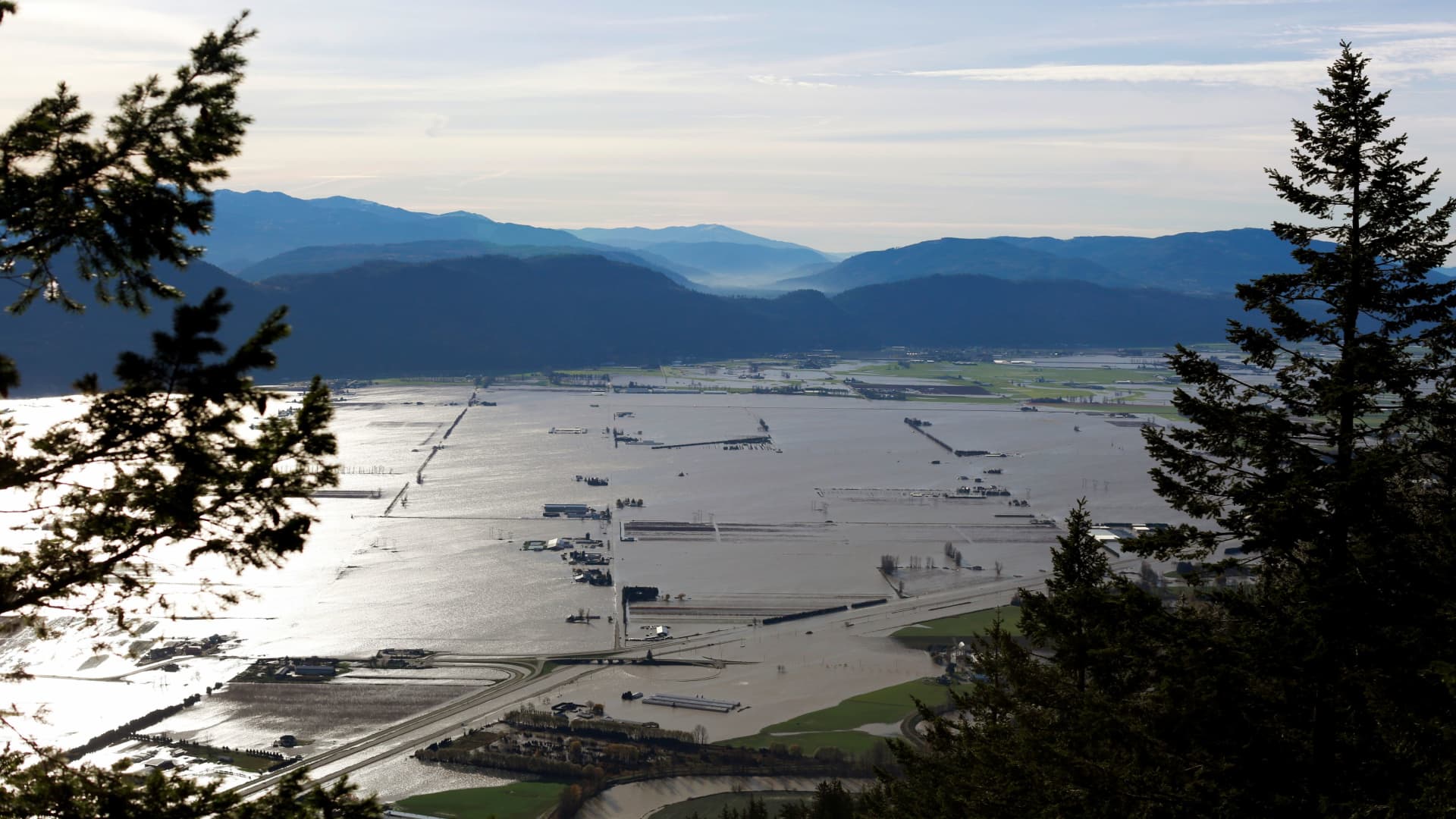 Flooded houses and farms are seen from the top of Sumas Mountain after rainstorms caused flooding and landslides in Abbotsford, British Columbia, Canada November 17, 2021.REUTERS/Jesse Winter