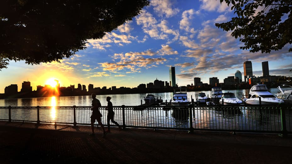 A view of the Charles River with the downtown Boston skyline in the background.