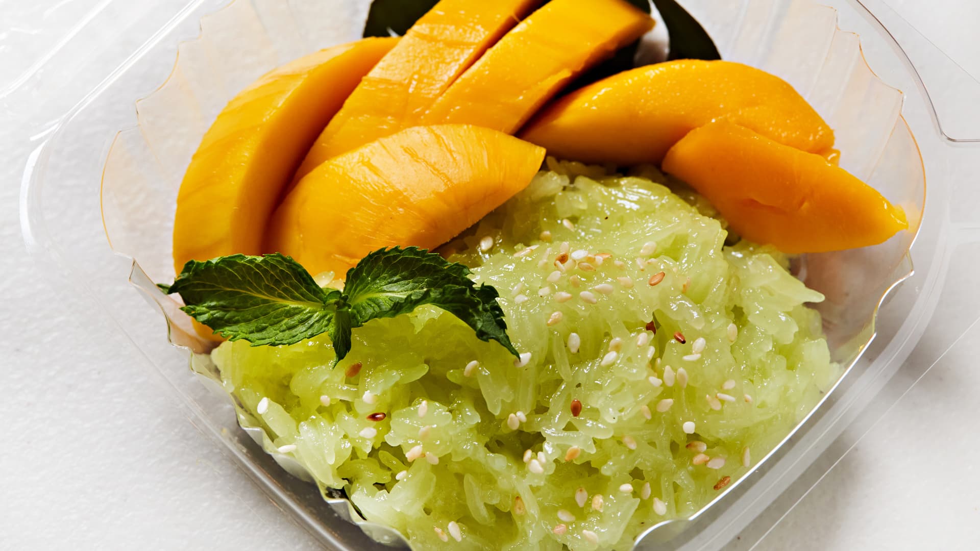 Mango sticky rice is a simple but famous Thai dessert made with glutinous rice, coconut milk, ripe mangos and mung beans.