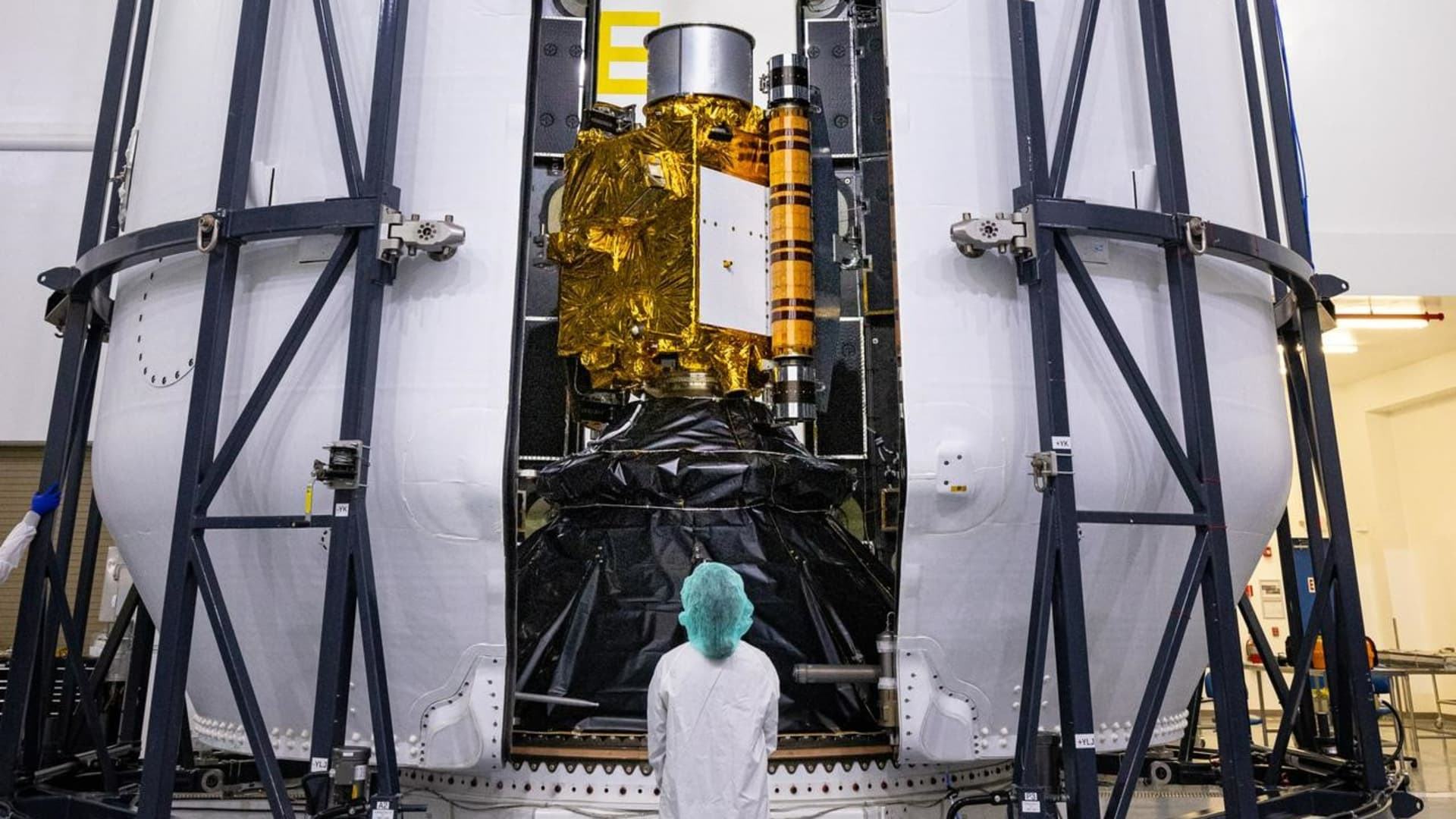 NASA's Double Asteroid Redirection Test (DART) spacecraft is put in the nosecone of SpaceX's Falcon 9 rocket in preparation for launch.