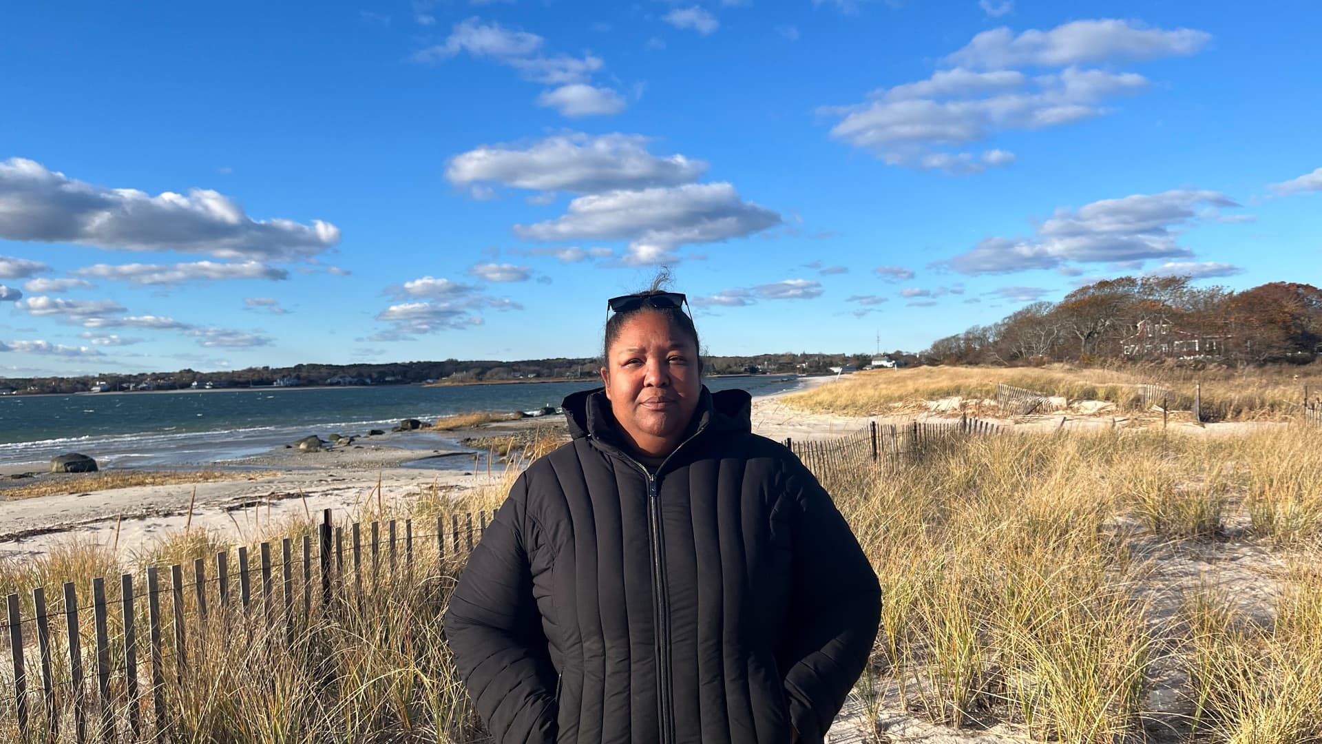 Shavonne Smith, director of the Shinnecock Nation's environmental department, stands on the shore of the Shinnecock Bay.