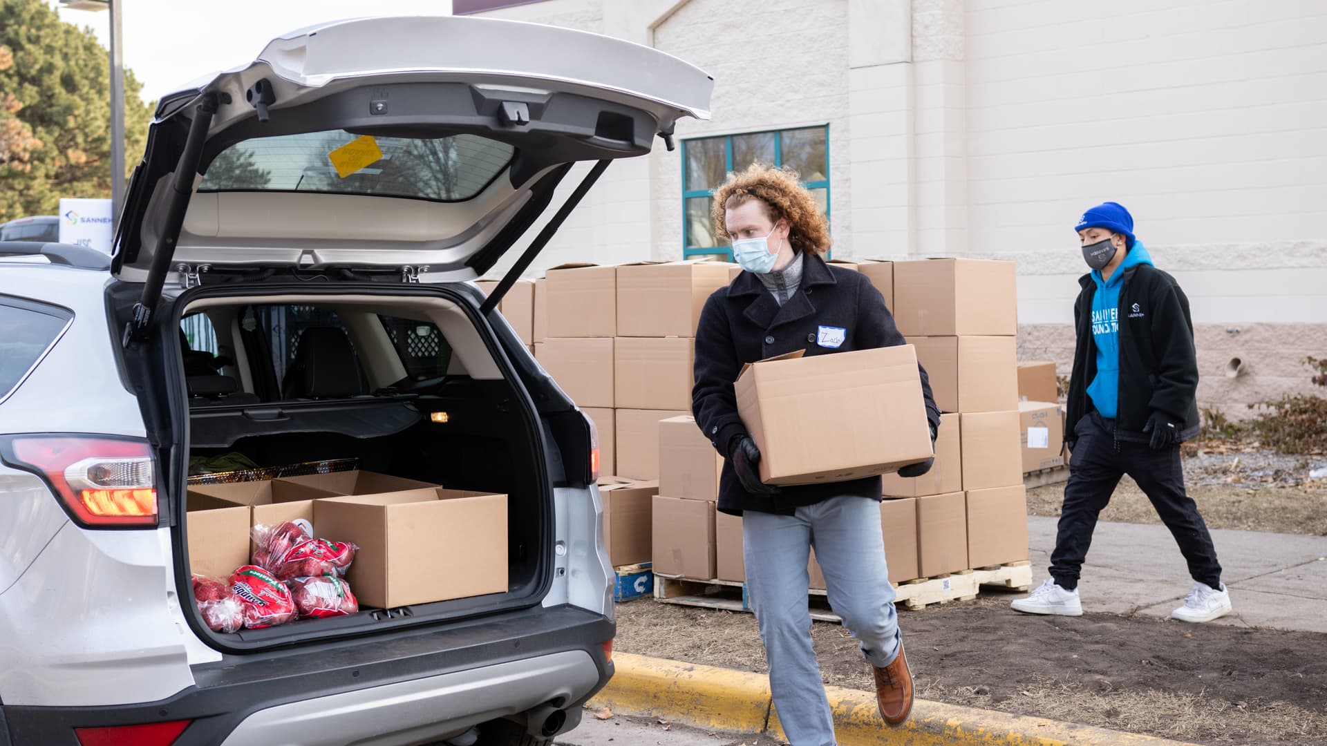 Second Harvest Heartland workers distribute food in a recent truck to trunk event. As Covid-19 cases in Minneapolis surge, so has the demand for food, said CEO Allison O'Toole.