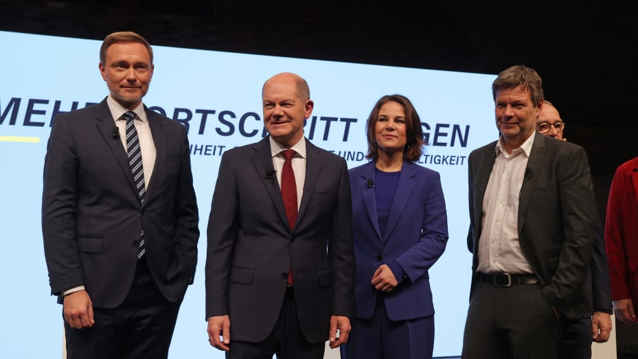 (From L to R) Christian Lindner of the German Free Democrats (FDP), Olaf Scholz of the German Social Democrats (SPD and, Annalene Baerbock and Robert Habeck of the Greens Party pose after presenting their mutually-agreed on coalition contract to the media on November 24, 2021 in Berlin, Germany.