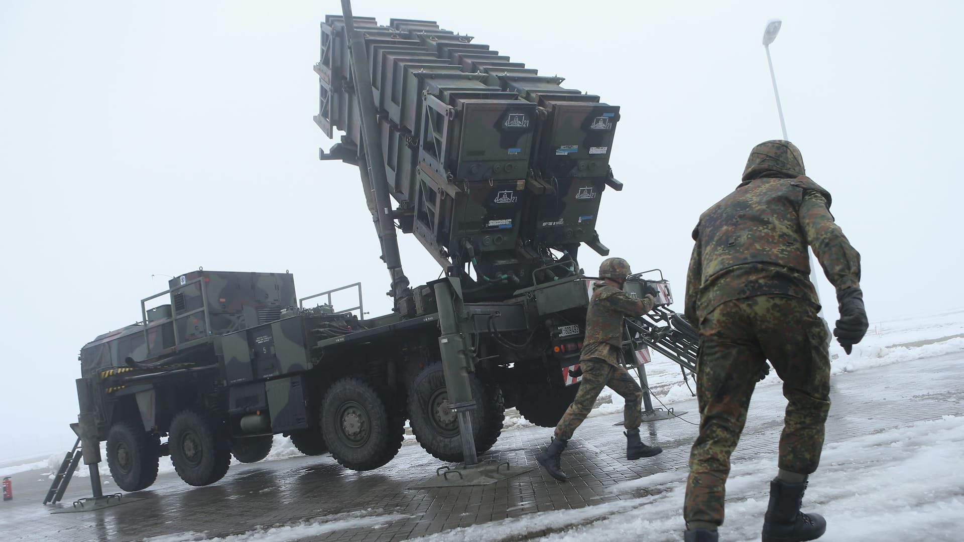 Members of the German Bundeswehr prepare a Patriot missile launching system during a press day presentation at the Luftwaffe Warbelow training center on December 18, 2012 in Warbelow, Germany.
