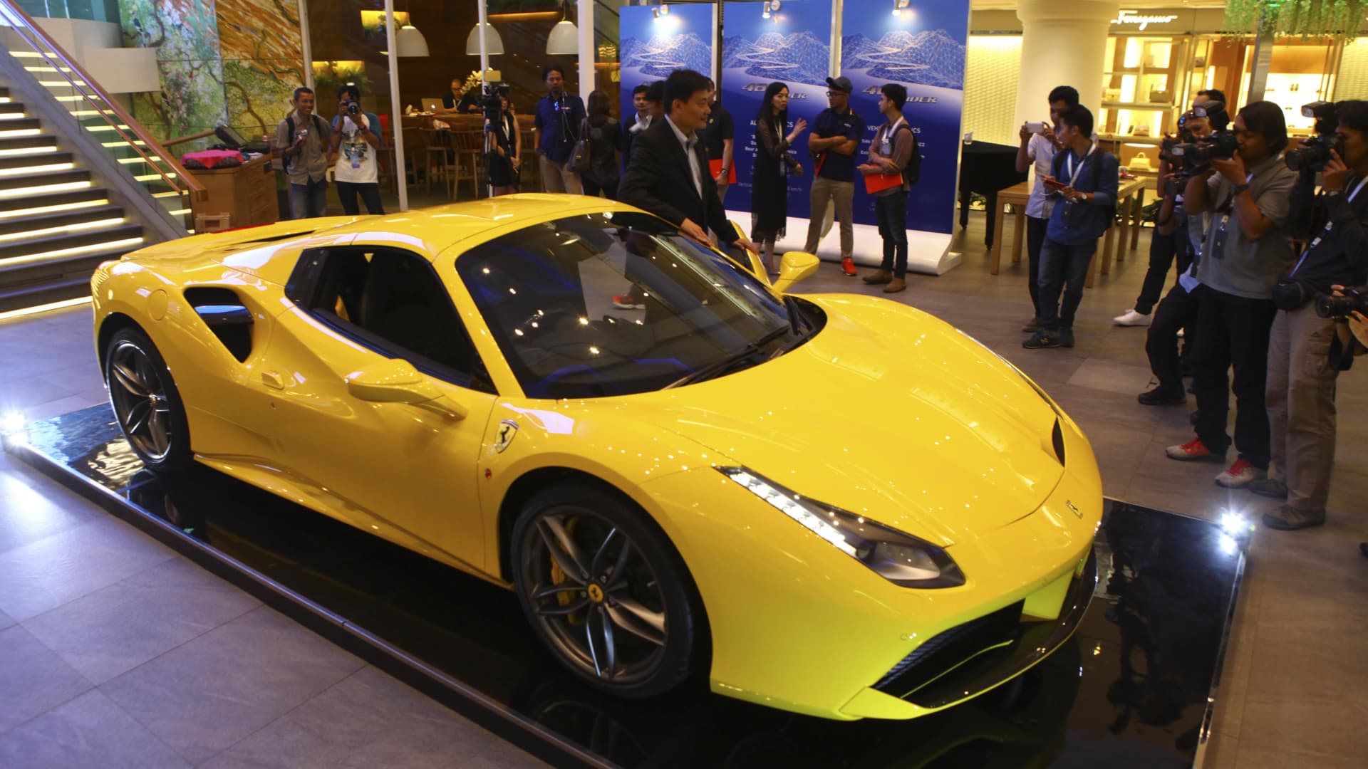 The Nightfall Group can arrange exotic car rentals, like a Ferrari 488 Spider, during vacations.