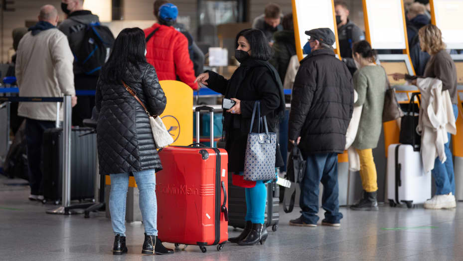 Passengers wait at Frankfurt Airport.