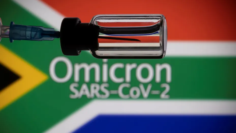 A vial and a syringe are seen in front of a displayed South Africa flag and words "Omicron SARS-CoV-2" in this illustration taken, November 27, 2021.