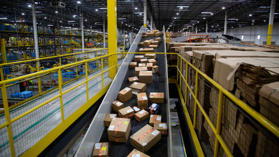 Packages move along a conveyor at an Amazon fulfillment center on Cyber Monday in Robbinsville, New Jersey, U.S., on Monday, Nov. 29, 2021.