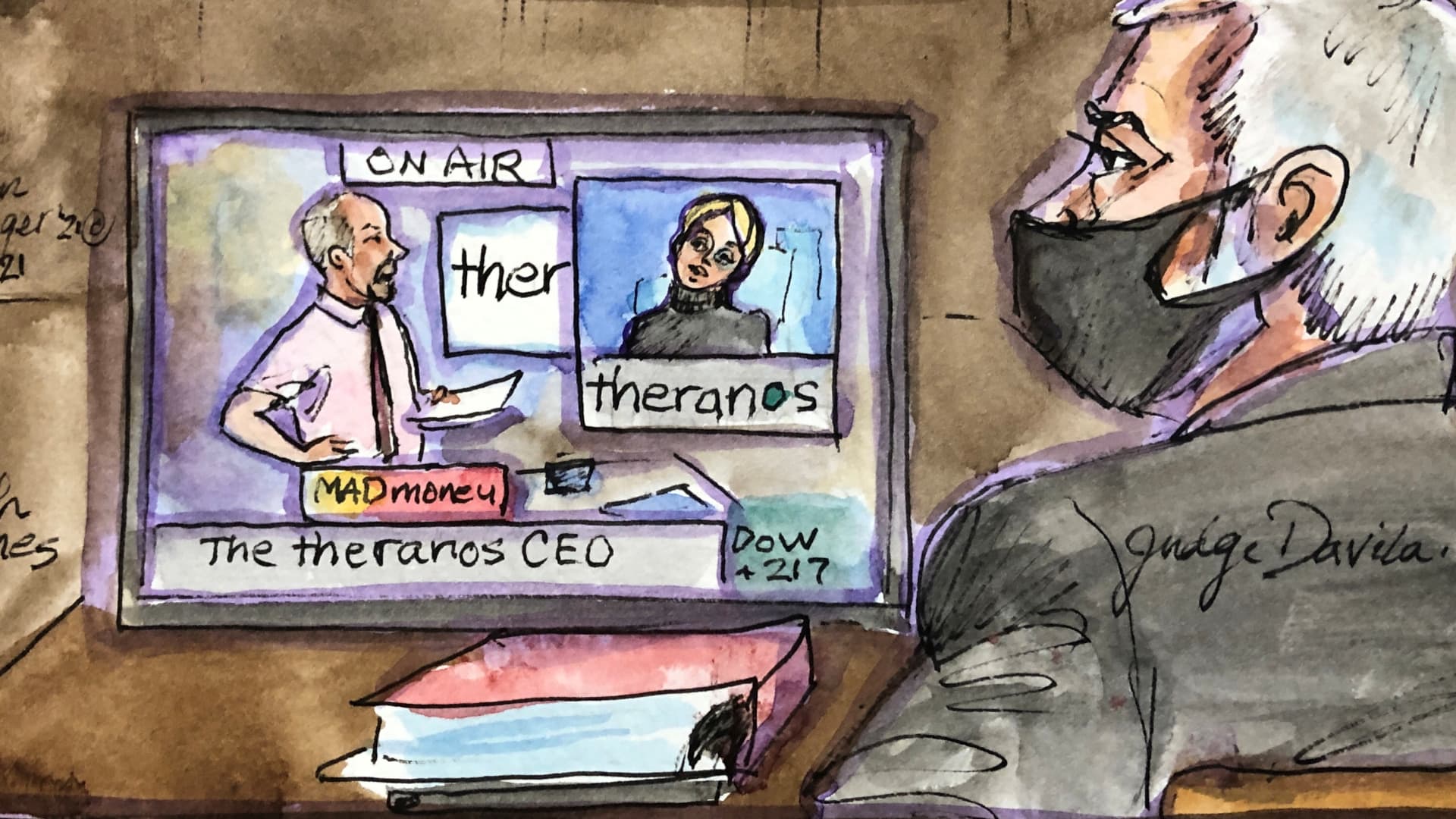 An image of CNBC program Mad Money appears on a screen as Theranos founder Elizabeth Holmes is cross examined by prosecutor Robert Leach at Robert F. Peckham U.S. Courthouse during her trial, in San Jose, California, November 30, 2021 in this courtroom sketch.