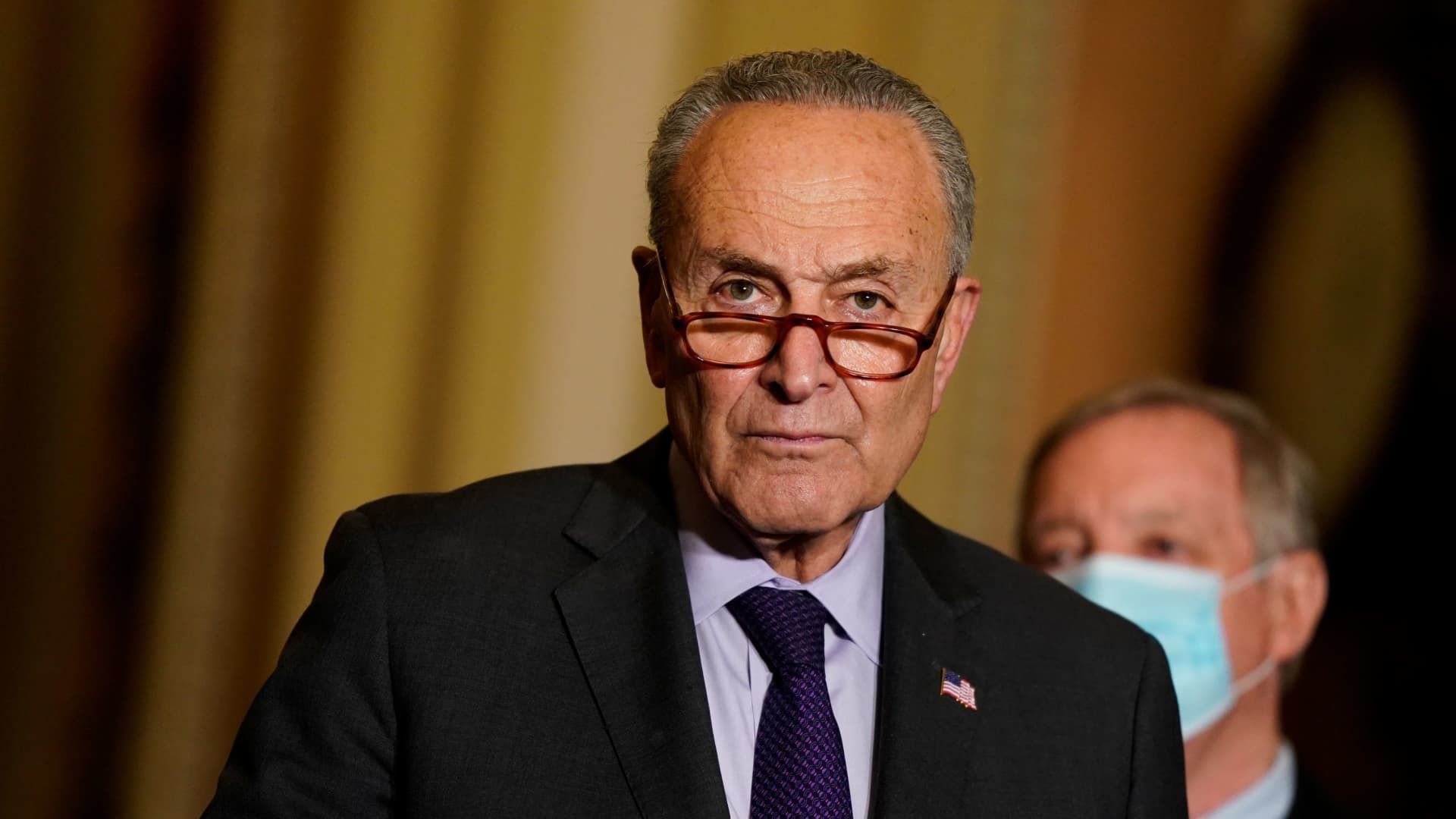 U.S. Senate Majority Leader Chuck Schumer (D-NY) speaks to reporters following the Senate Democrats weekly policy lunch at the U.S. Capitol in Washington, November 30, 2021.