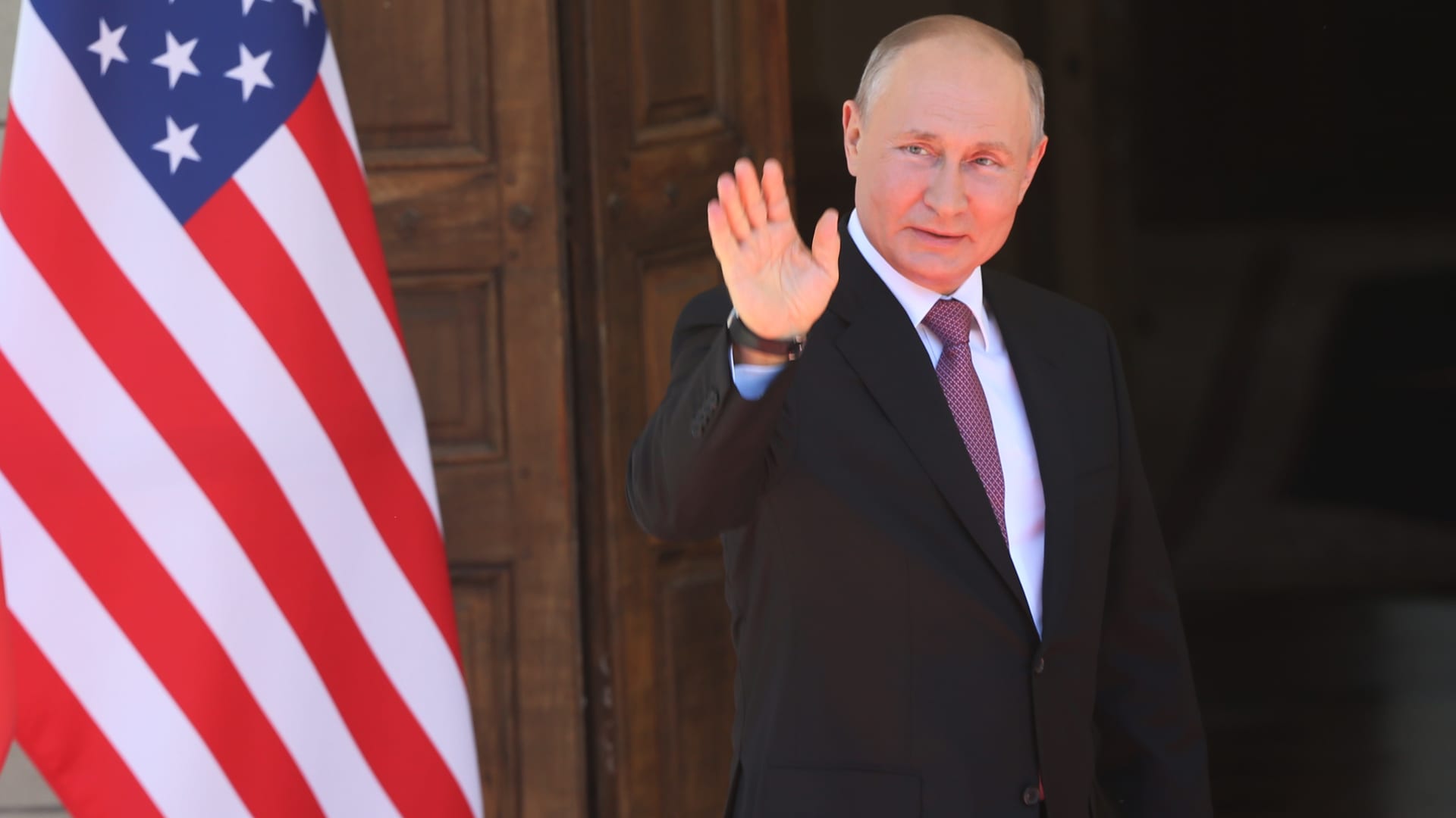 Russian President Vladimir Putin waves during the US - Russia Summit 2021 at the La Grange Villa near the Geneva Lake, on June 16, 2021 in Geneva, Switzerland.