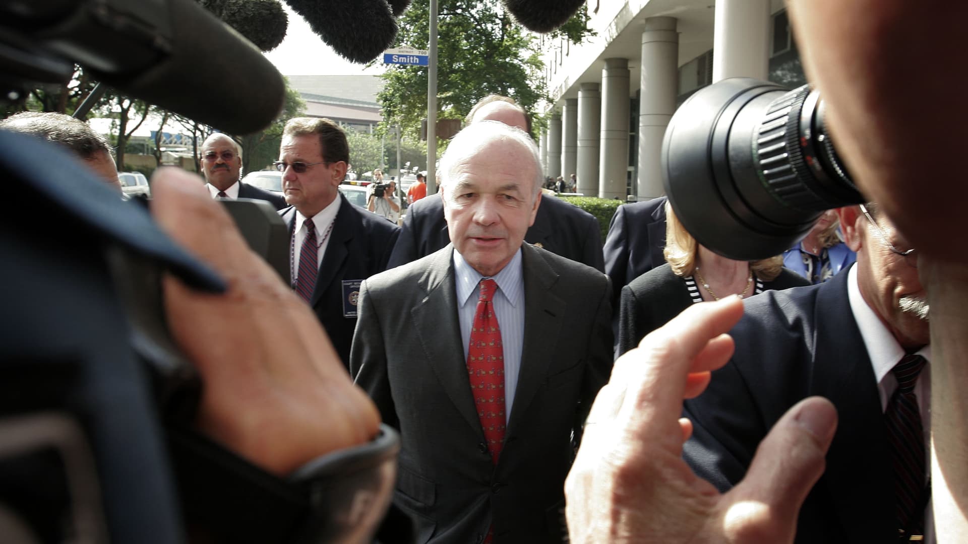 Former Enron chairman Kenneth Lay (C) leaves the Bob Casey U.S. Courthouse after the day's proceedings in his fraud and conspiracy trial, April 26, 2006, in Houston, Texas.