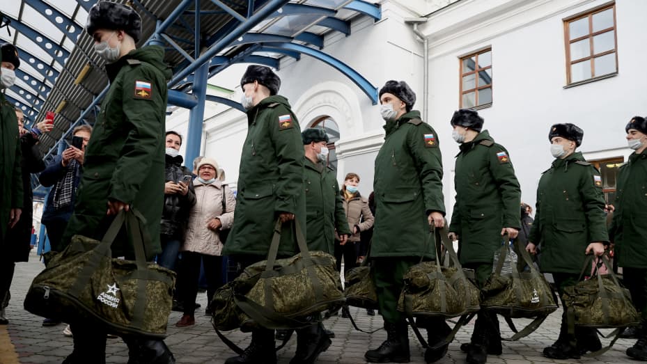 Conscripts get on a train at a railway station before departing for military service with the Russian Army. This year, the autumn military call-up in Russia lasts from October 1 to December 31; estimated 127,500 men are going to be drafted.