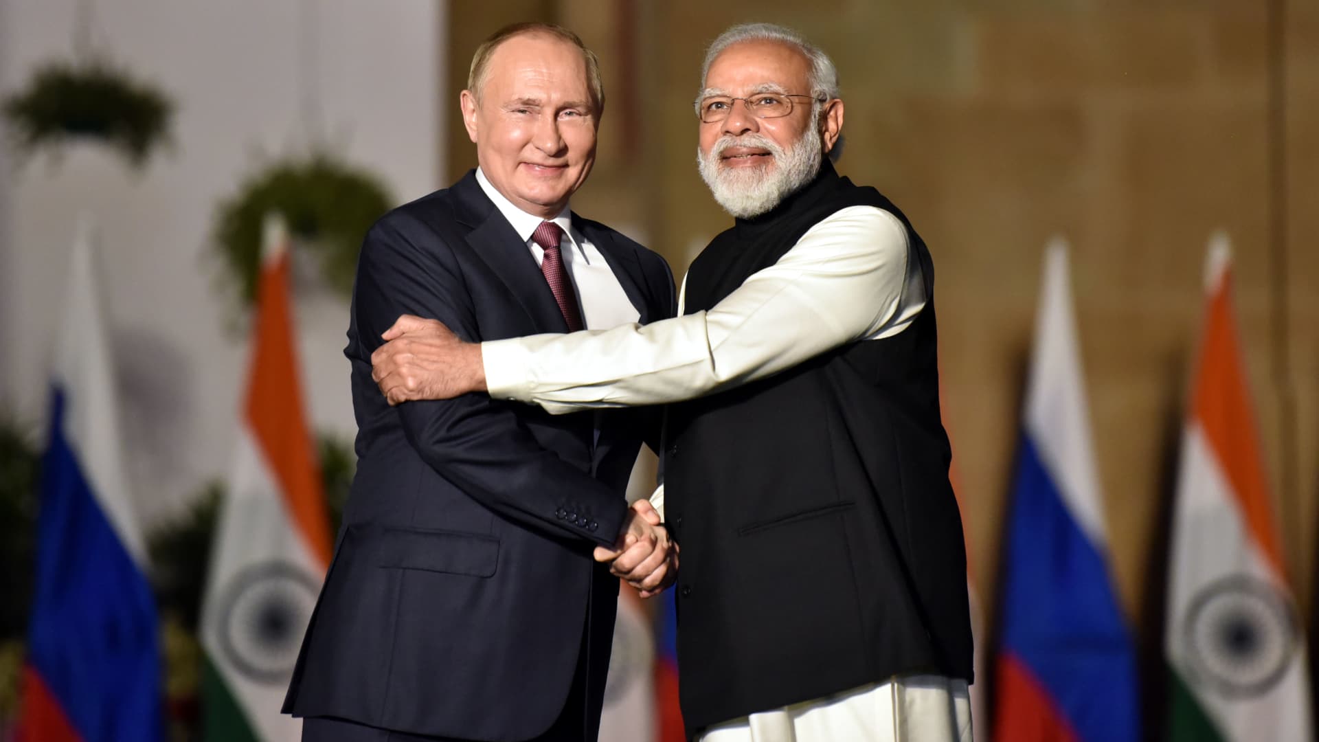 Indian Prime Minister Narendra Modi shakes hands with Russian President Vladimir Putin during their meeting at Hyderabad House, on December 6, 2021 in New Delhi, India.