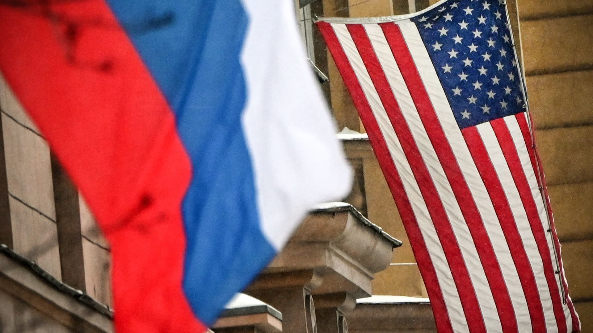 A Russian flag flies next to the US embassy building in Moscow on December 7, 2021.