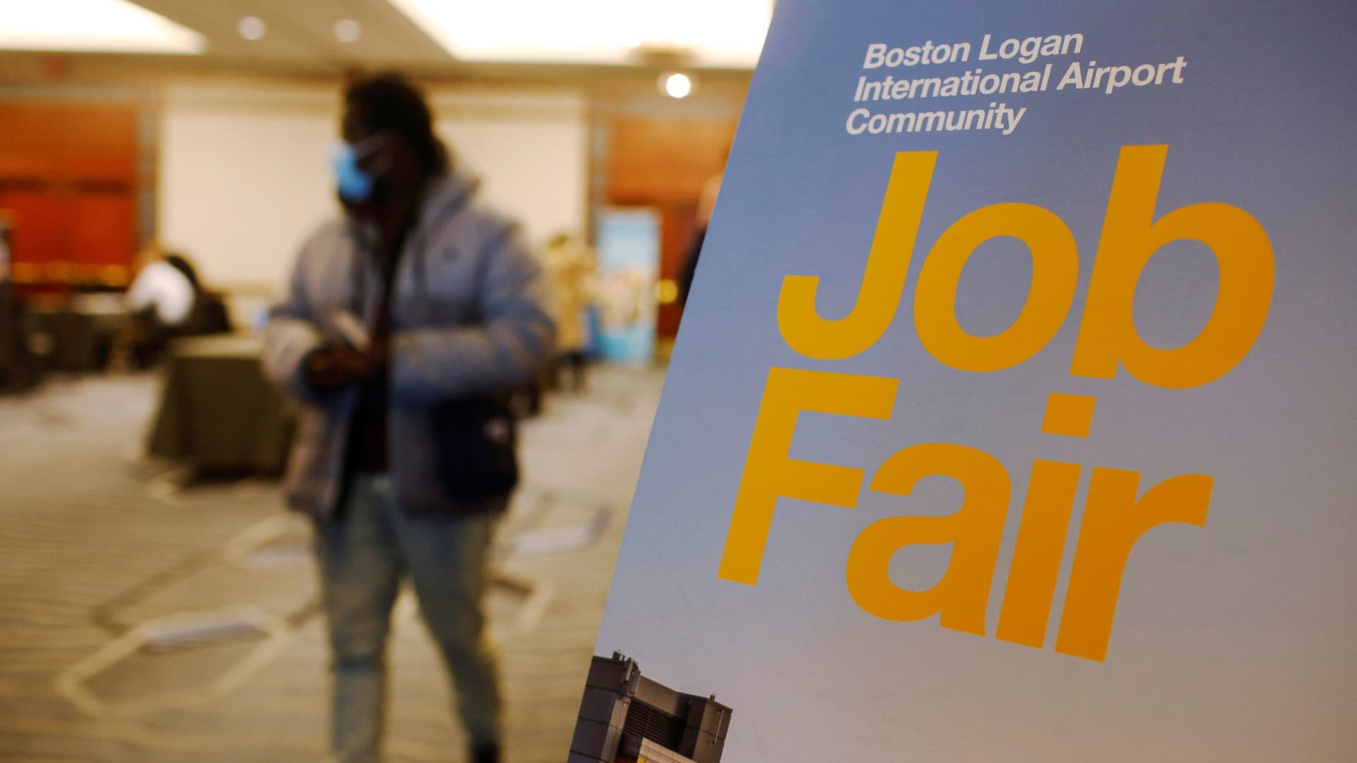 A job seeker leaves the job fair for airport related employment at Logan International Airport in Boston, Massachusetts, U.S., December 7, 2021.