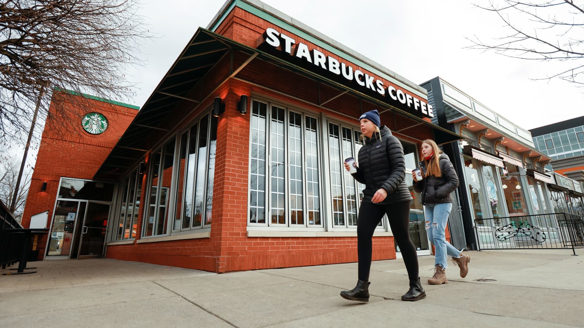 People walk past a Starbucks in Buffalo, New York, December 7, 2021.