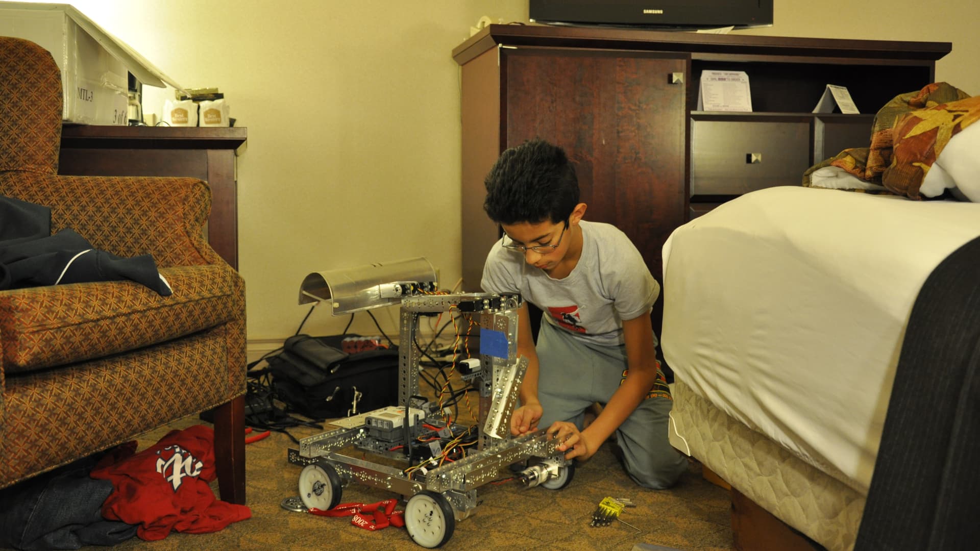 Alex Rodrigues building robots at 13 years old.