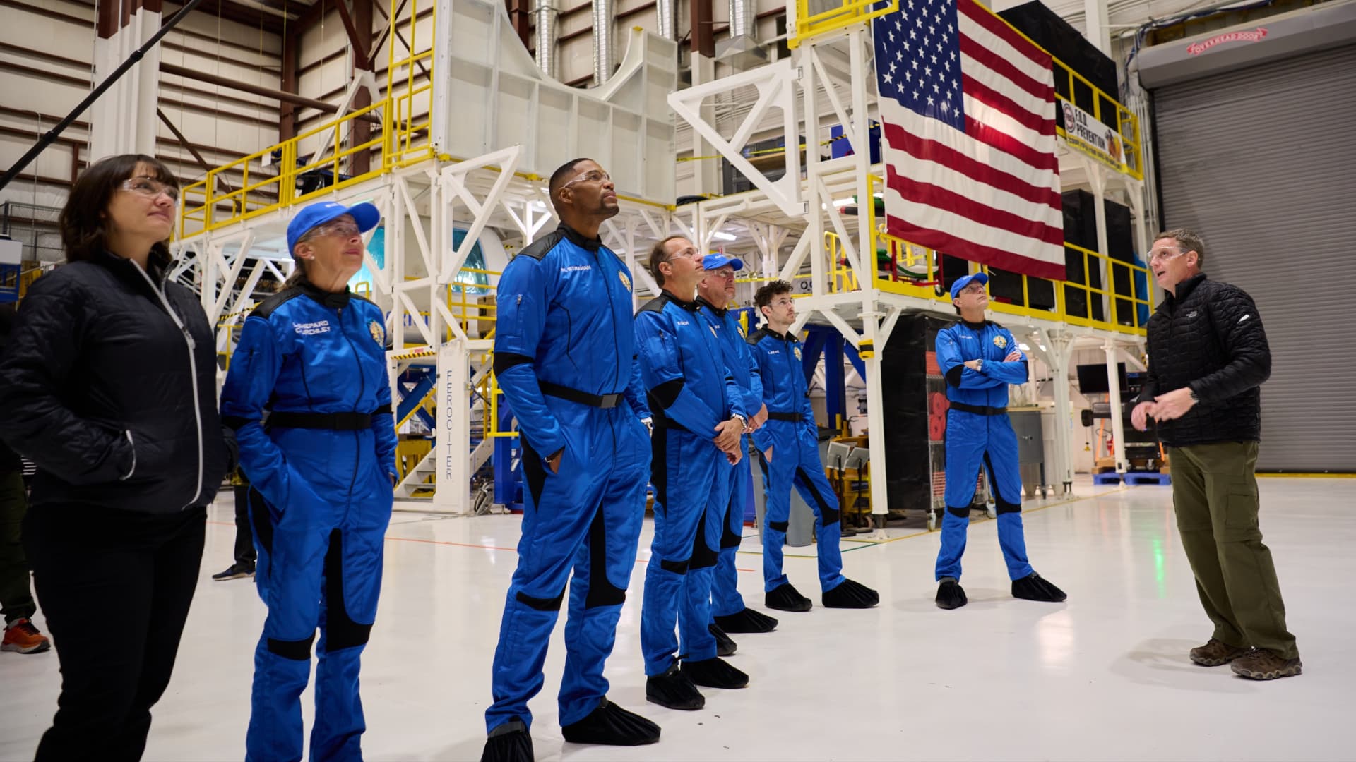 The crew of NS-19 takes a look at their ride to space. From left: Laura Shepard Churchley, Michael Strahan, Evan Dick, Lane Bess, Cameron Bess, and Dylan Taylor.