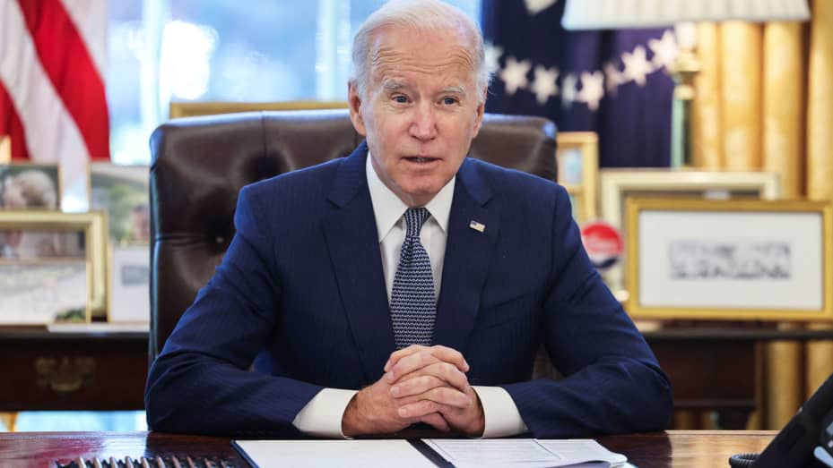 U.S. President Joe Biden speaks prior to signing an executive order intended to reduce bureaucracy around government services for the public, in the Oval Office at the White House in Washington, U.S., December 13, 2021.