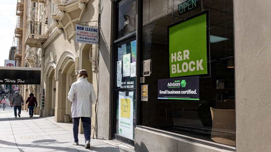 Pedestrians walk past an H&R Block office in San Francisco, California, U.S., on Monday, March 8, 2021.