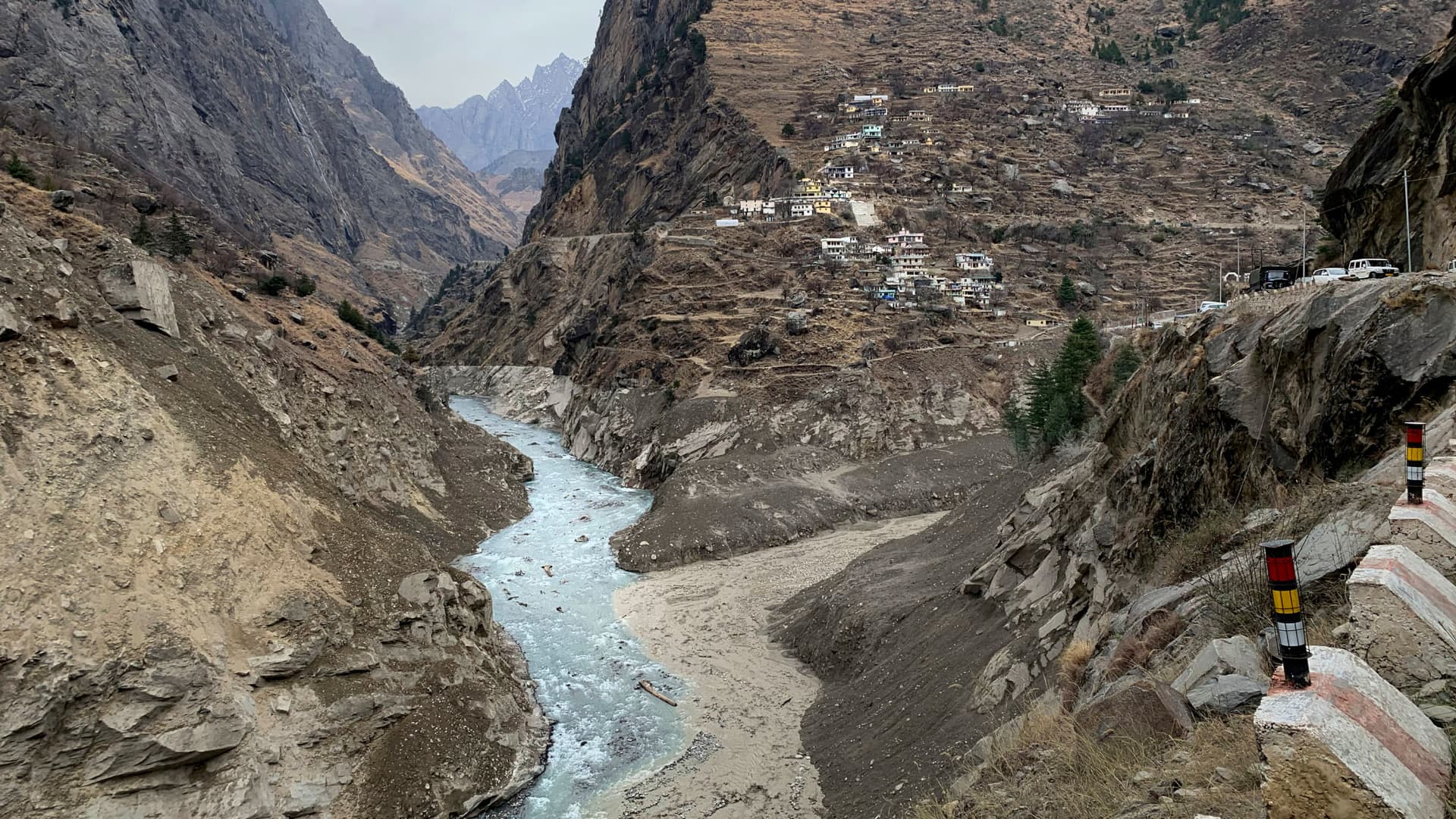 Muddy water flows into Alaknanda river two days after a part of a Himalayan glacier broke off sending a devastating flood downriver in Tapovan area of the northern state of Uttarakhand, India, Tuesday, Feb. 9, 2021.