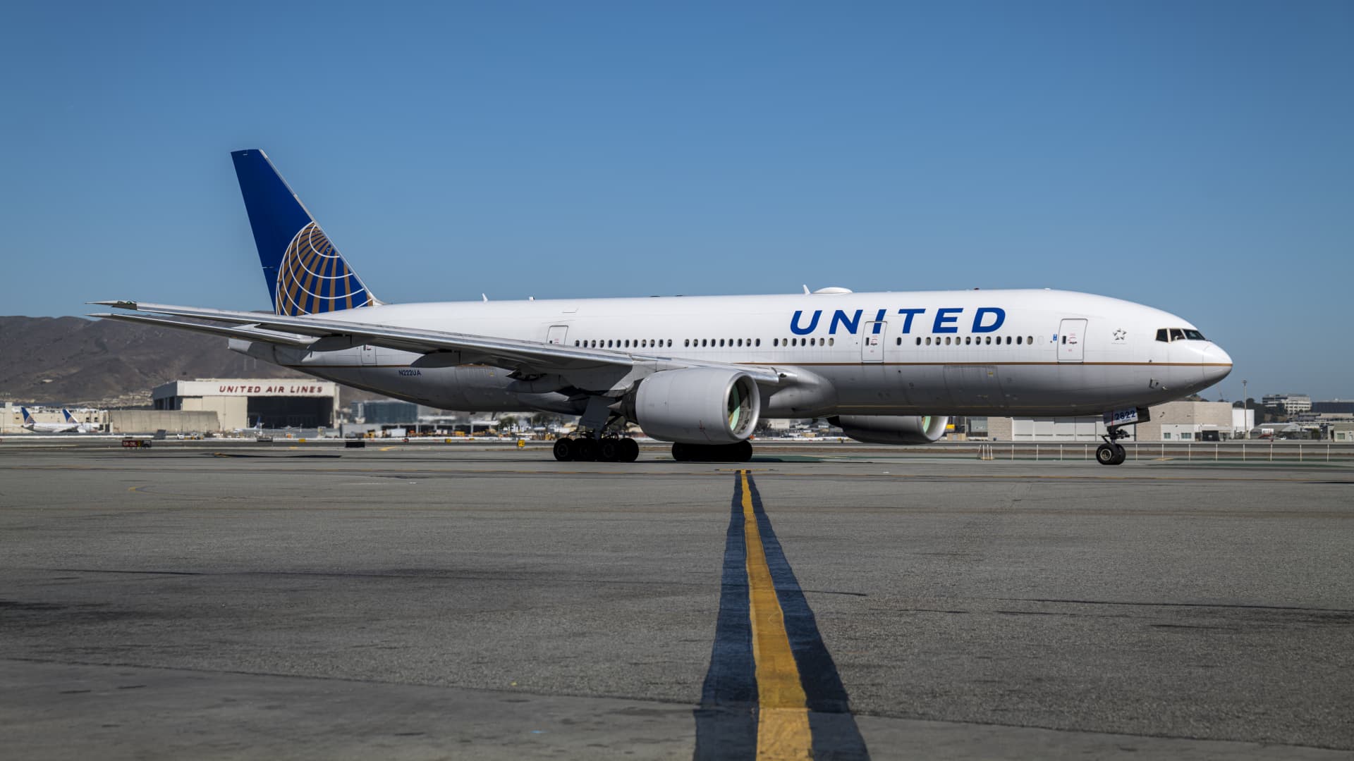 Stocks making the biggest moves midday: United Airlines, AT&T, Tesla and more