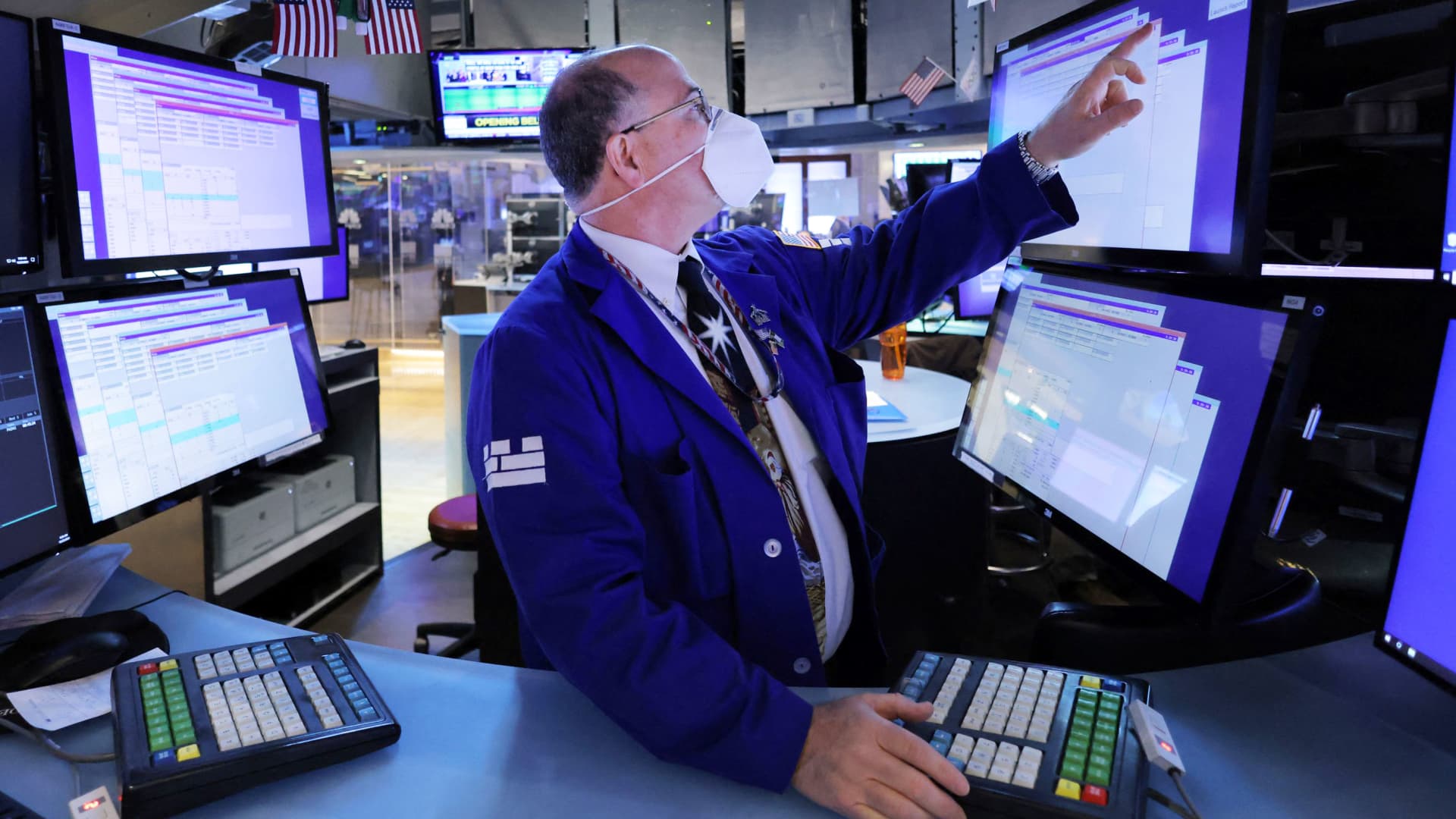 A trader works on the trading floor on the last day of trading before Christmas at the New York Stock Exchange (NYSE) in Manhattan, New York City, December 23, 2021.
