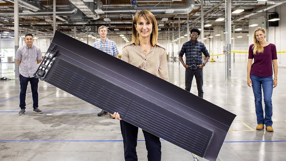 Gabriela Bunea, Senior Vice President of Solar R&D at GAF Energy, holds the company's new solar shingle.