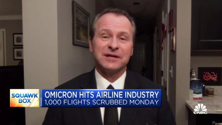 Omicron Covid variant hits airline industry with thousands of cancellations