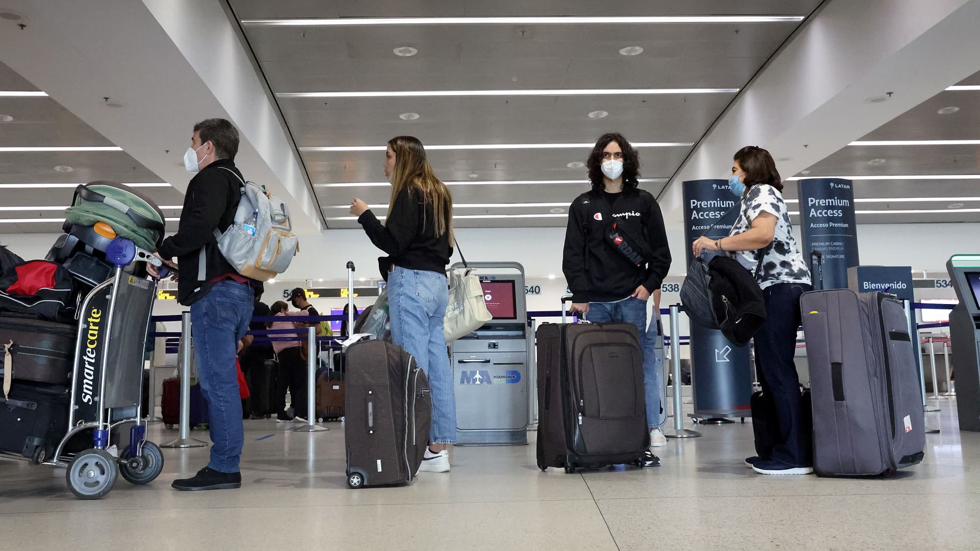 Travelers make their way through Miami International Airport on December 28, 2021 in Miami, Florida.