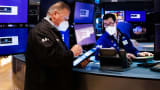 Traders work on the floor of the New York Stock Exchange (NYSE) in New York, on Monday, Jan. 3, 2022.