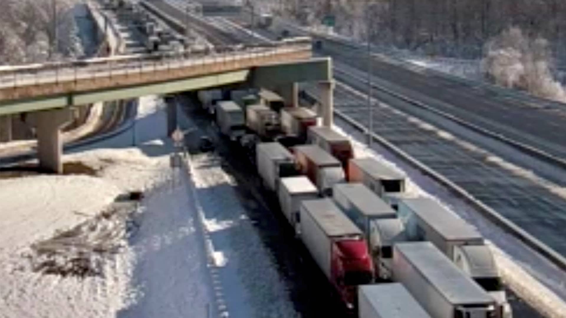 Stranded vehicles are seen in still image from highway traffic camera video as authorities worked to reopen an icy stretch of Interstate 95 closed after a storm blanketed the U.S. region in snow a day earlier, near Colchester, Virginia, January 4, 2022.