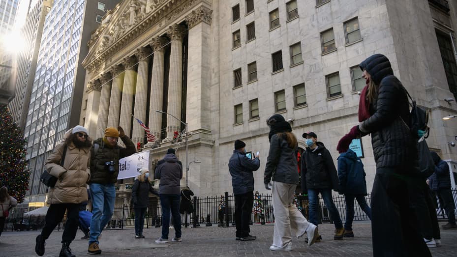 People walk past the New York Stock Exchange (NYSE) on January 4, 2022 in New York City.