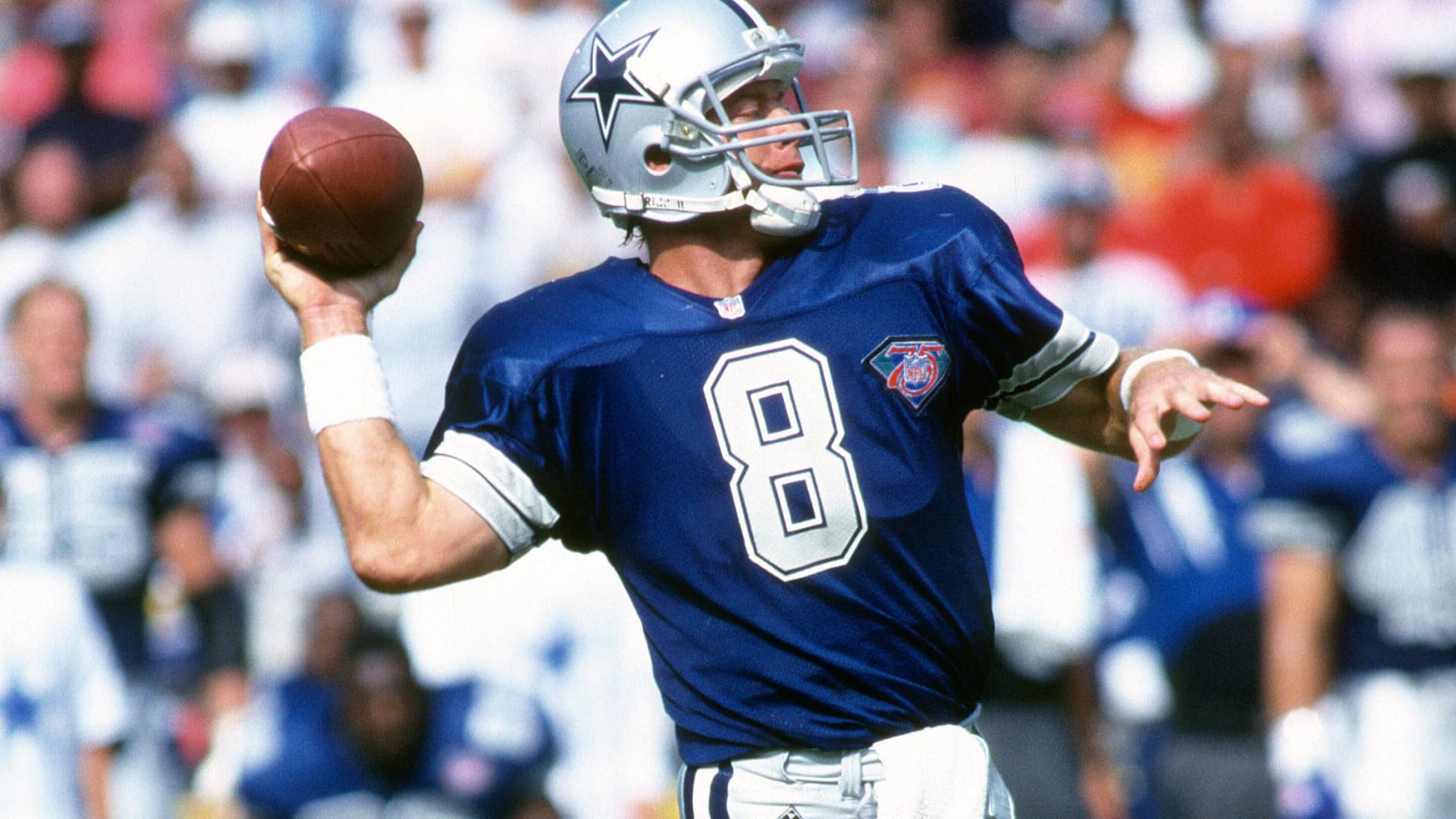 Troy Aikman #8 of the Dallas Cowboys throws a pass against the Washington Redskins during an NFL football game October 2, 1994 at RFK Stadium in Washington, D.C.