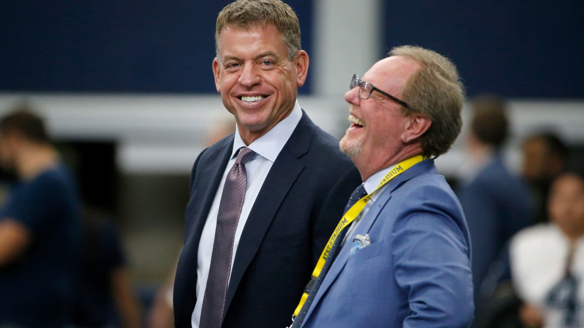 Broadcast personality Troy Aikman, left, talks with sports reporter Ed Werder, right, before a NFL football game between the New York Giants and Dallas Cowboys in Arlington, Texas, Sunday, Sept. 8, 2019.