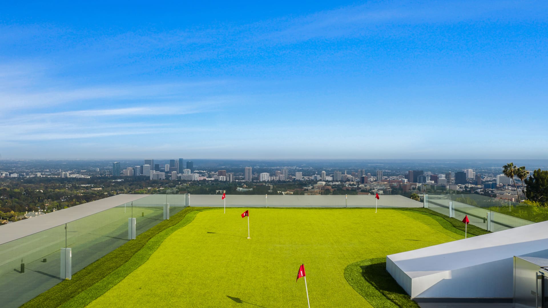 The meaghome's 10,000 sq. ft. roof deck includes a golf green with impressive views of downtown.