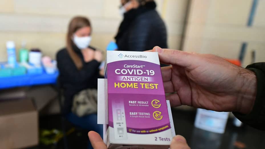 A rapid Covid-19 test kit is displayed after being given out for free to people receiving their Covid-19 vaccines or boosters at Union Station in Los Angeles, California, on January 7, 2022.