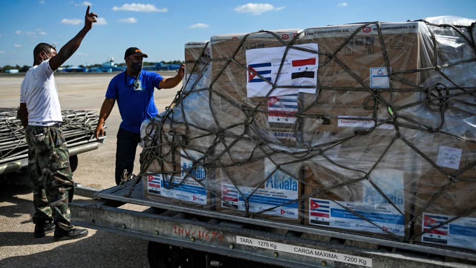 Workers transport a shipment of the Cuban Soberana Plus vaccine against Covid-19, to be donated by the Cuban government to Syria, at Jose Marti International Airport in Havana, on Jan. 7, 2022.