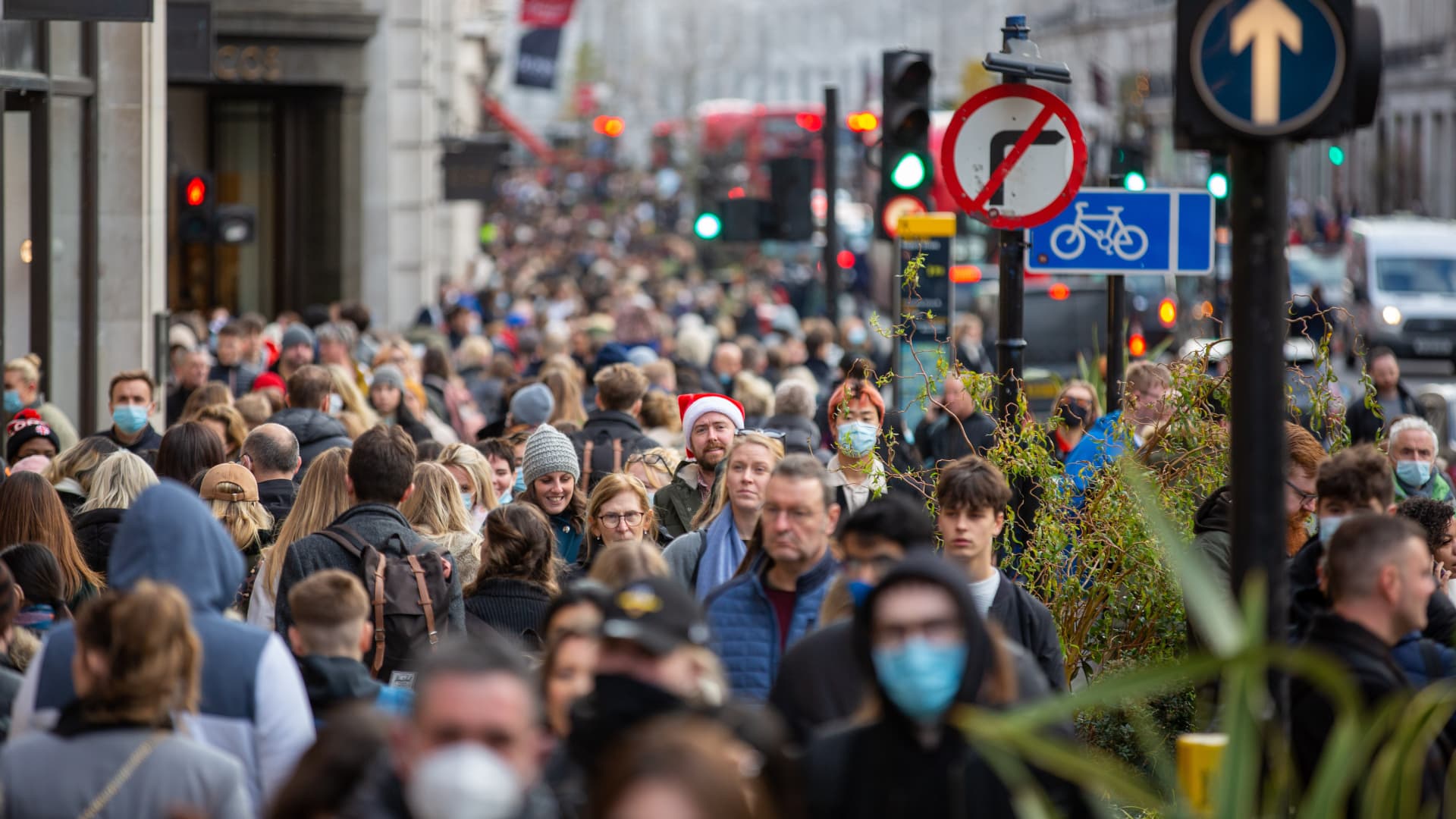 People walk in Regent Street, in London.