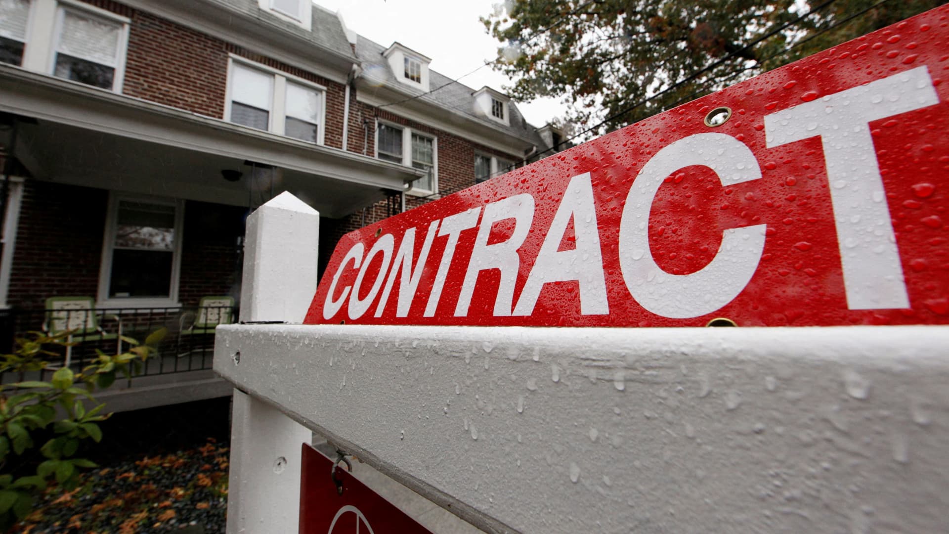 A home with a sign indicating that it is under contract to be sold is seen in a neighborhood of downtown Washington.