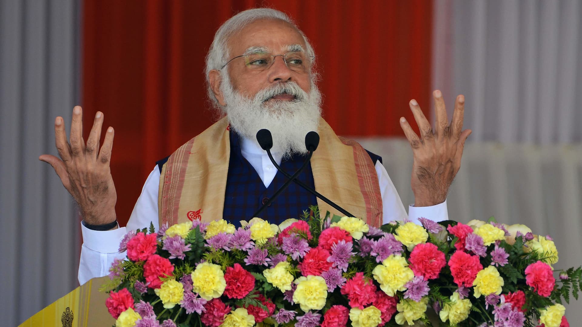 Indian Prime Minister Narendra Modi addresses a public meeting at Jerenga Pathar in the Sivasagar district of India's Assam state on Jan. 23, 2021.