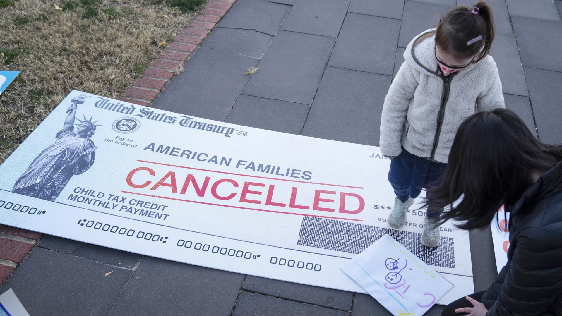 Parents and children participate in a demonstration organized by the ParentsTogether Foundation in support of the child tax credit portion of the Build Back Better bill outside of the U.S. Capitol on Dec. 13, 2021.