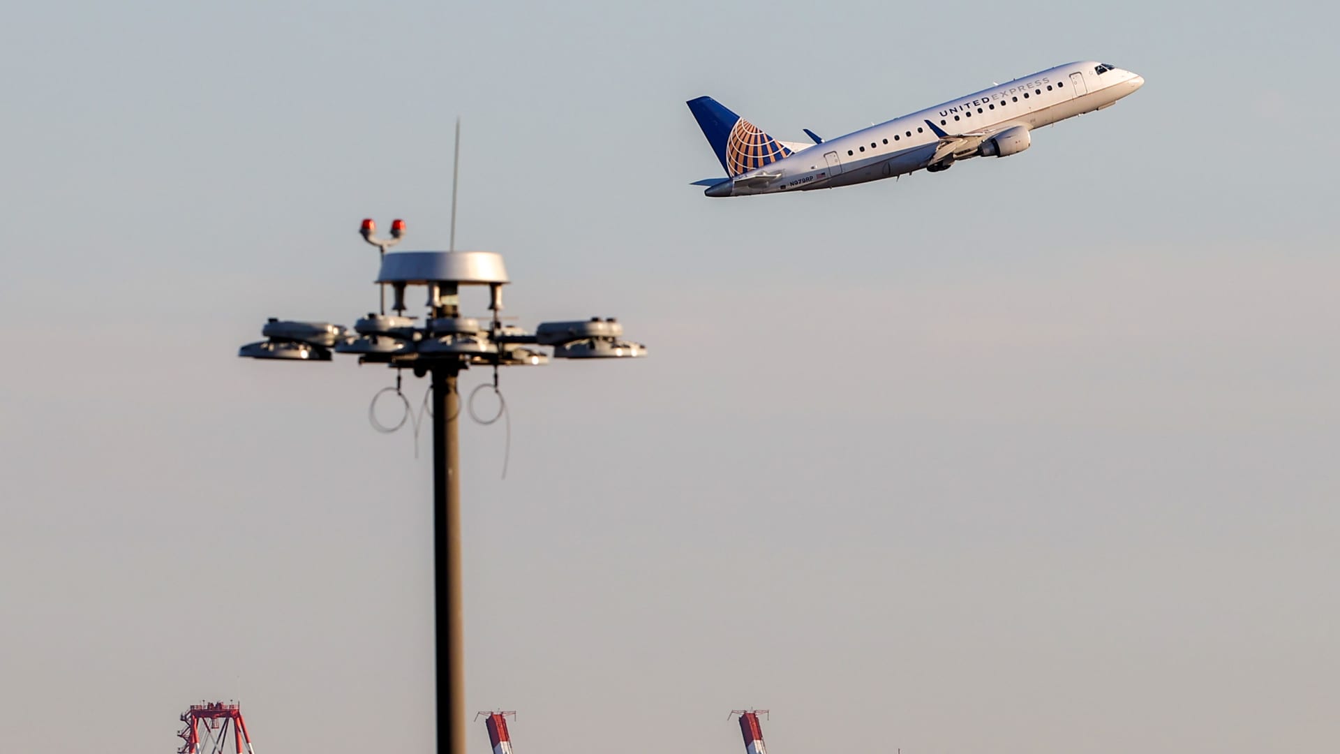 A passenger airplane is departing from Newark Liberty International Airport in Newark, New Jersey, on January 19, 2022.