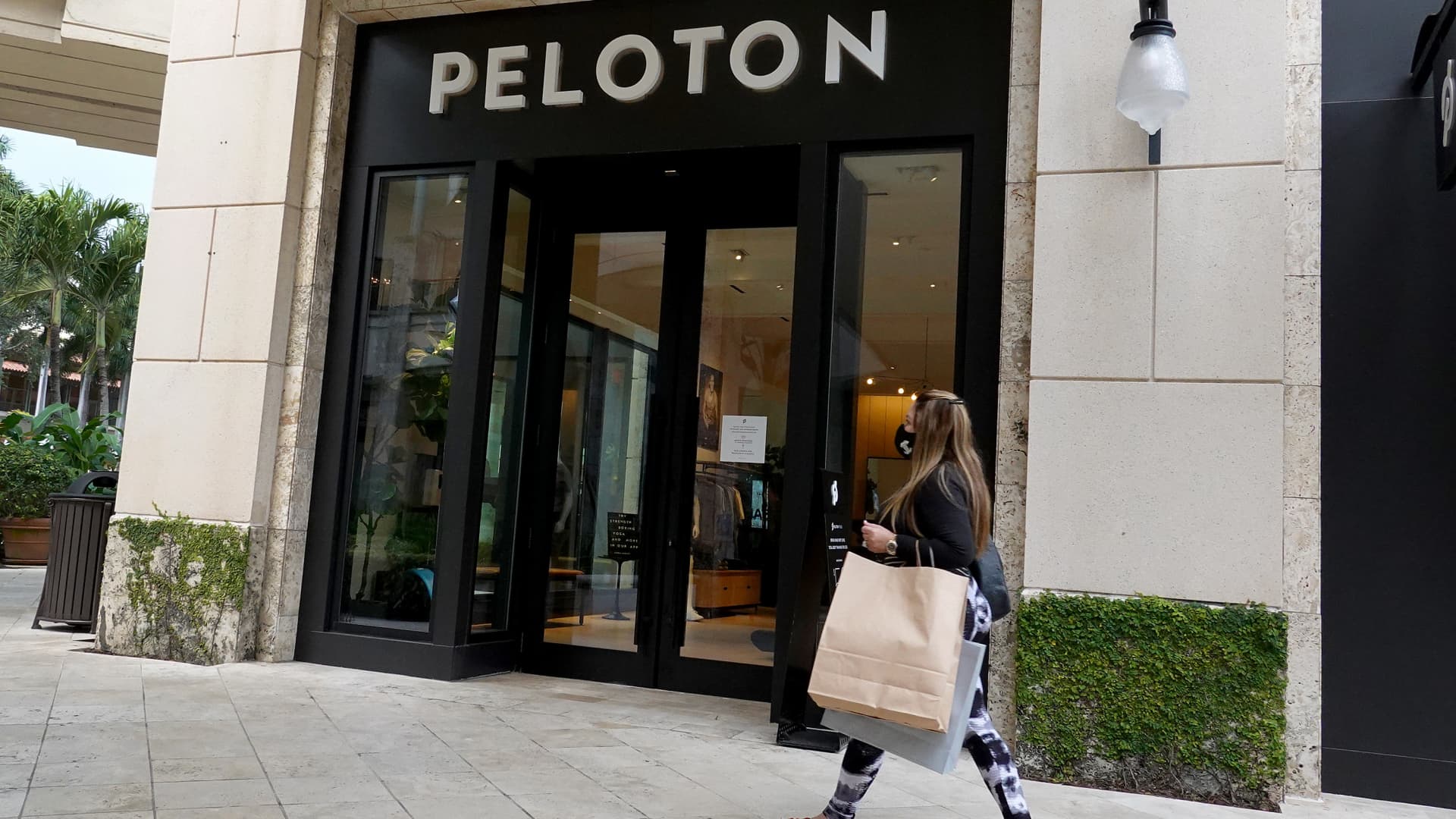 A person walks past a Peloton store on January 20, 2022 in Coral Gables, Florida.