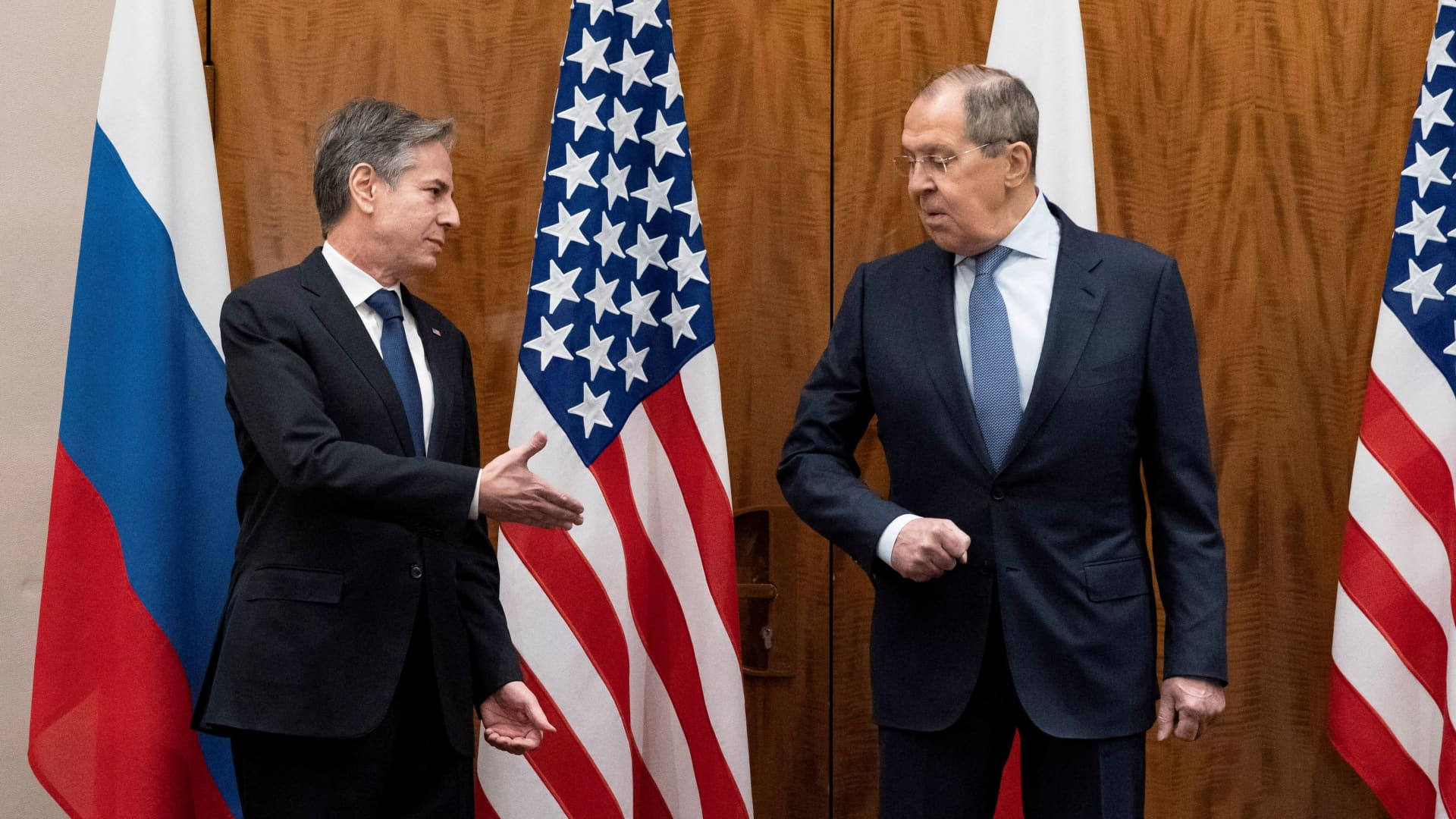 U.S. Secretary of State Antony Blinken greets Russian Foreign Minister Sergei Lavrov before their meeting, in Geneva, Switzerland, January 21, 2022.