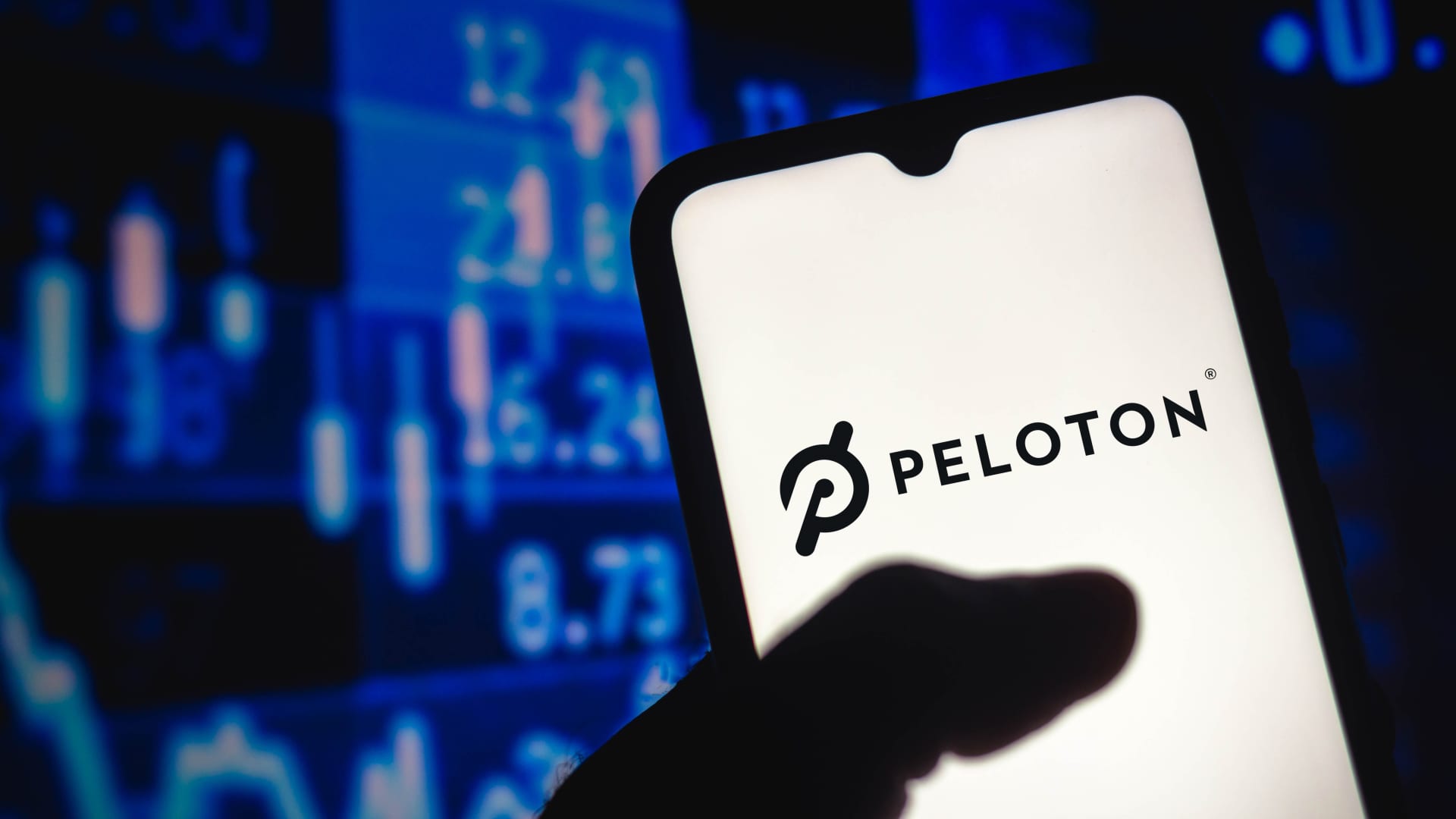 Peloton shares plummet after company reports a big loss and declining revenue